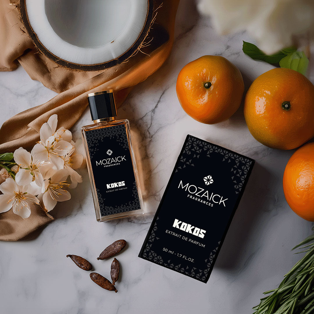 KOKOS Extrait de Parfum 50 ml by MOZAICK – bottle and box on marble with oranges and coconut